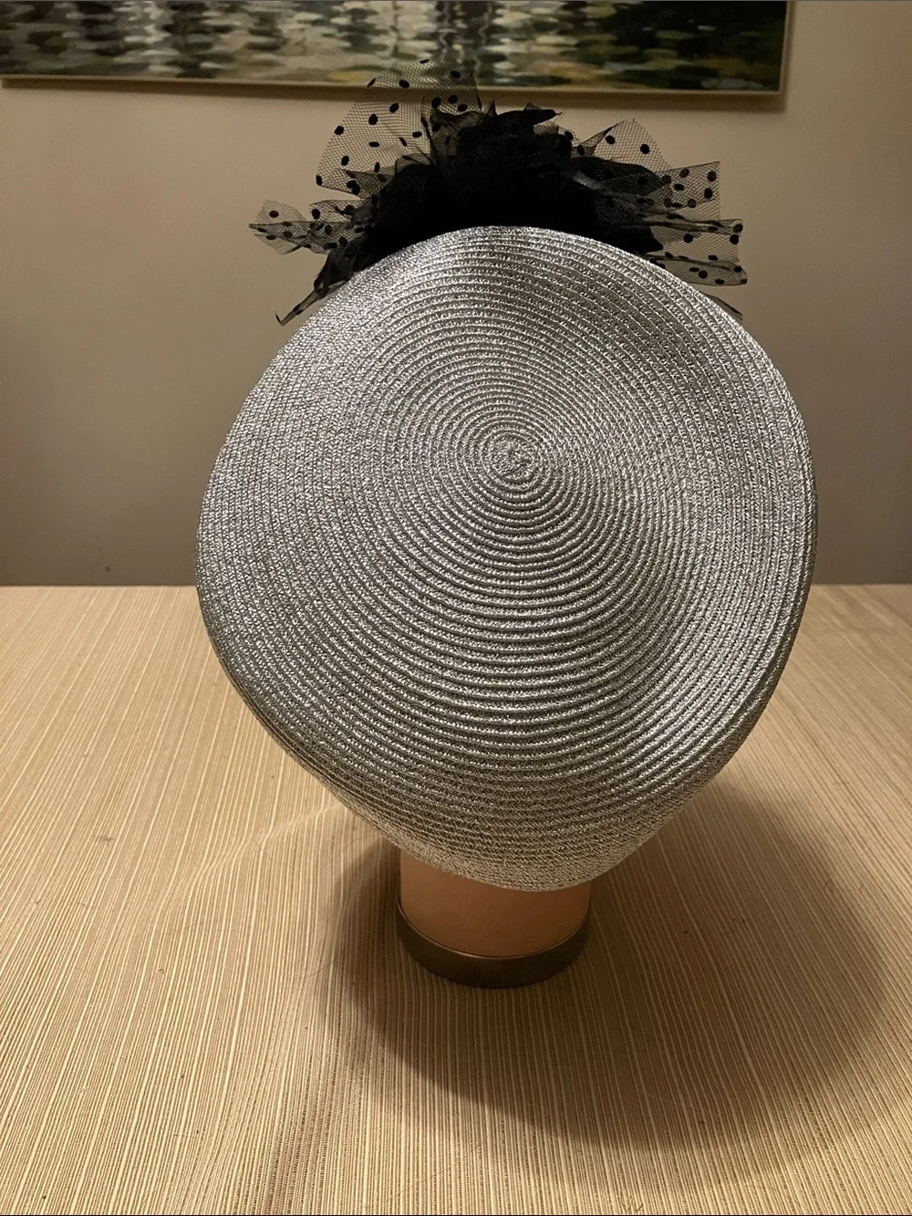 Elegant Metallic Silver Hat with Black Floral Accent